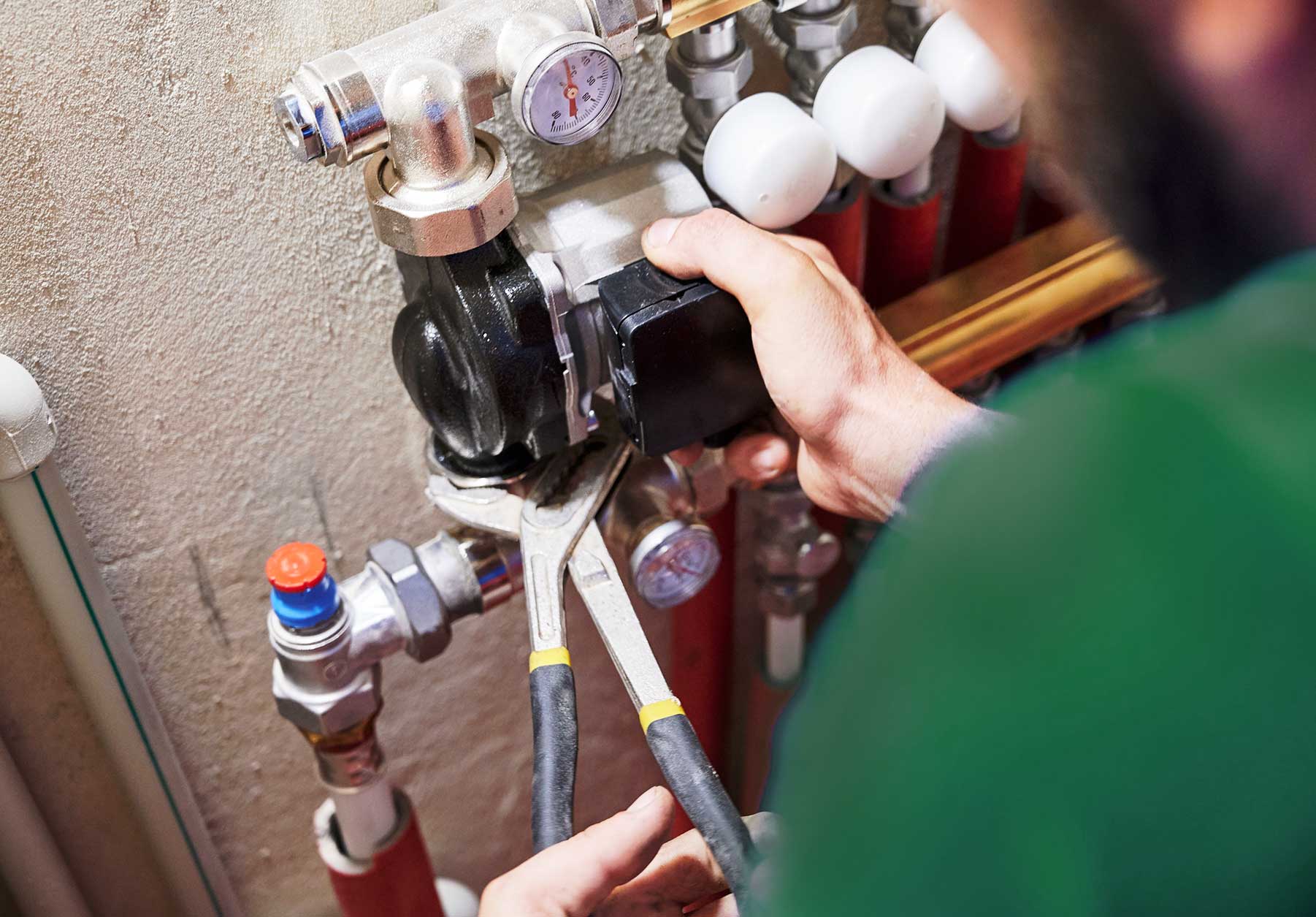 Heating Engineer working on heating plumbing system
